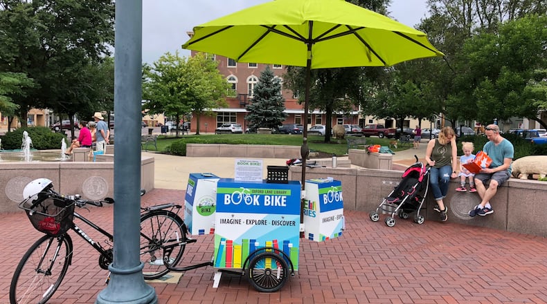 Oxford Lane Library will bring out its "Book Bike" to the Red Brick Friday event Aug. 4.