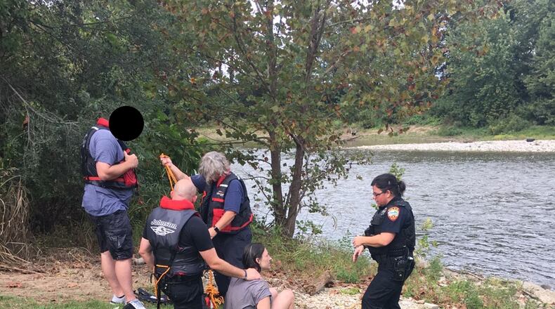 Franklin police and fire/EMS crews rescued a woman after she was seen jumping into the Great Miami River near Second and River streets Tuesday afternoon. CONTRIBUTED/CITY of FRANKLIN