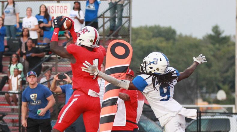 Dillon Lee of Fairfield makes in interception in front of Gabe Ramirez. Fairfield defeated visiting Hamilton 34-27 in a Week 4 high school football game on Friday, Sept. 20, 2019. MARC PENDLETON / STAFF