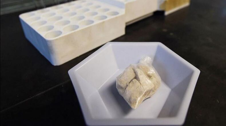 The drug “gray death” lies in a dish at the crime lab of the Georgia Bureau of Investigations. Investigators who nicknamed the mixture have detected it, or recorded overdoses blamed on it, in Ohio, Alabama and Georgia. (AP Photo/Mike Stewart)