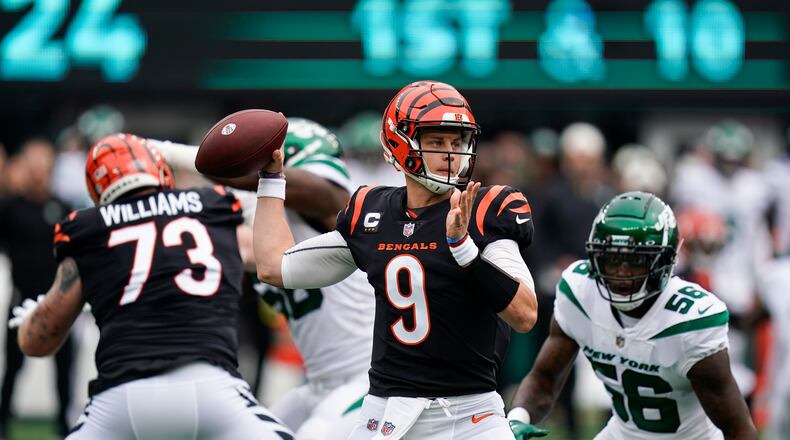 Cincinnati Bengals quarterback Joe Burrow looks to throw a pass during the first half of an NFL football game New York Jets, Sunday, Sept. 25, 2022, in East Rutherford, N.J. (AP Photo/Seth Wenig)