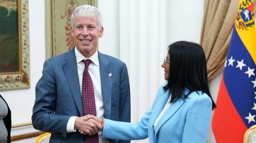 Venezuelan acting President Delcy Rodriguez greets U.S. Energy Secretary Chris Wright at Miraflores presidential palace in Caracas, Venezuela, Wednesday, Feb. 11, 2026. (AP Photo/Ariana Cubillos)