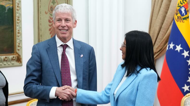 Venezuelan acting President Delcy Rodriguez greets U.S. Energy Secretary Chris Wright at Miraflores presidential palace in Caracas, Venezuela, Wednesday, Feb. 11, 2026. (AP Photo/Ariana Cubillos)