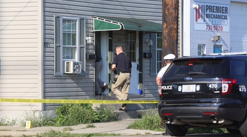 Hamilton police investigate in 2016 the Sept. 6 fatal shooting of shooting of Timothy Dugan at a Maple Avenue residence. GREG LYNCH/STAFF