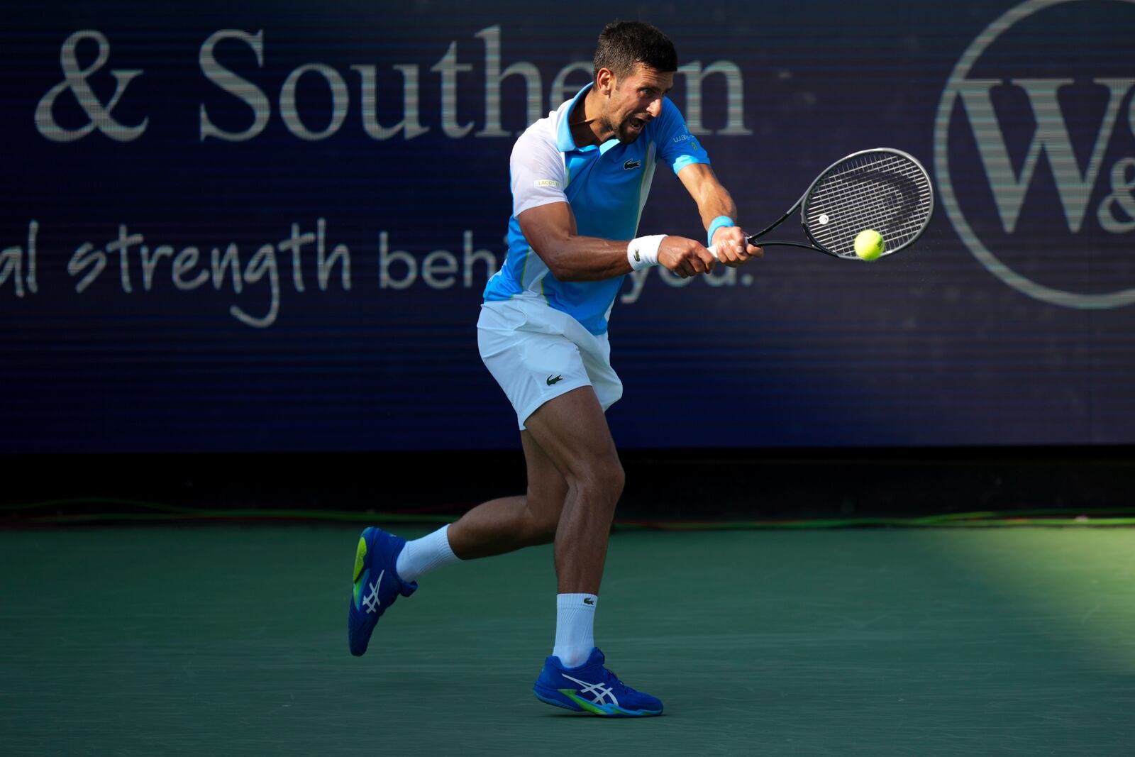 Novak Djokovic, of Serbia, returns a shot to Carlos Alcaraz, of Spain, during the men's singles final of the Western & Southern Open tennis tournament, Sunday, Aug. 20, 2023, in Mason, Ohio. (AP Photo/Aaron Doster)