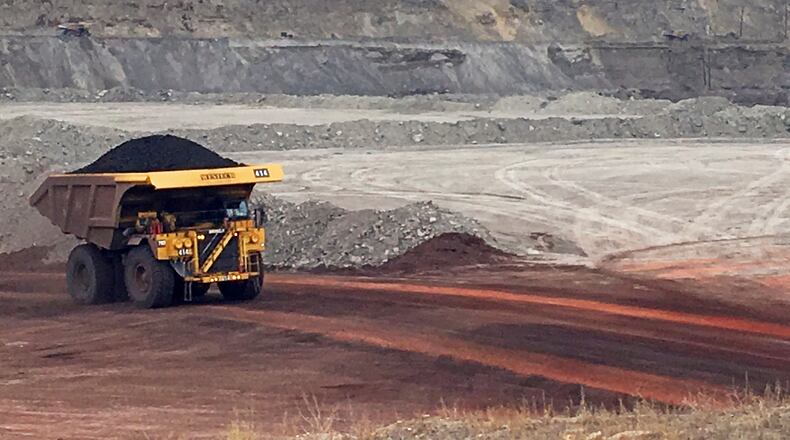 FILE - A dump truck hauls coal at the Eagle Butte Mine, now owned by Eagle Specialty Materials, LLC, near Gillette, Wyo., March 28, 2017. (AP Photo/Mead Gruver, File)