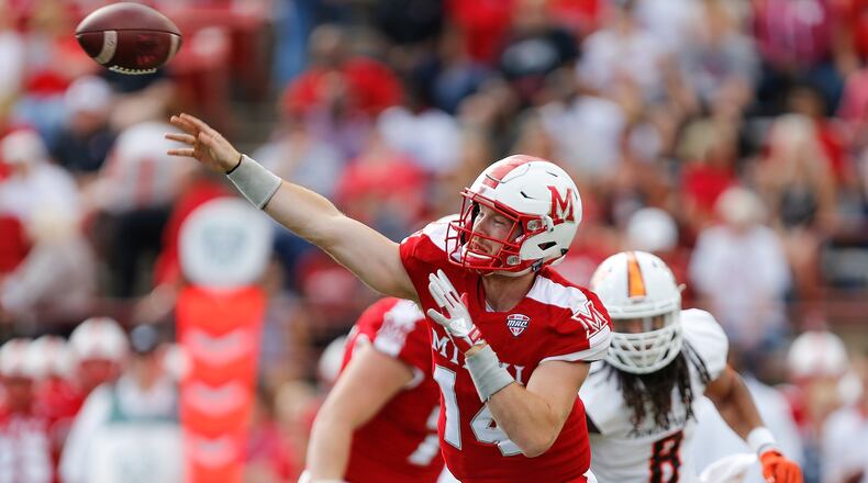 OXFORD, OH - OCTOBER 07: Gus Ragland #14 of the Miami Ohio Redhawks throws a pass against the Bowling Green Falcons during the first half on October 7, 2017 in Oxford, Ohio. (Photo by Michael Reaves/Getty Images)