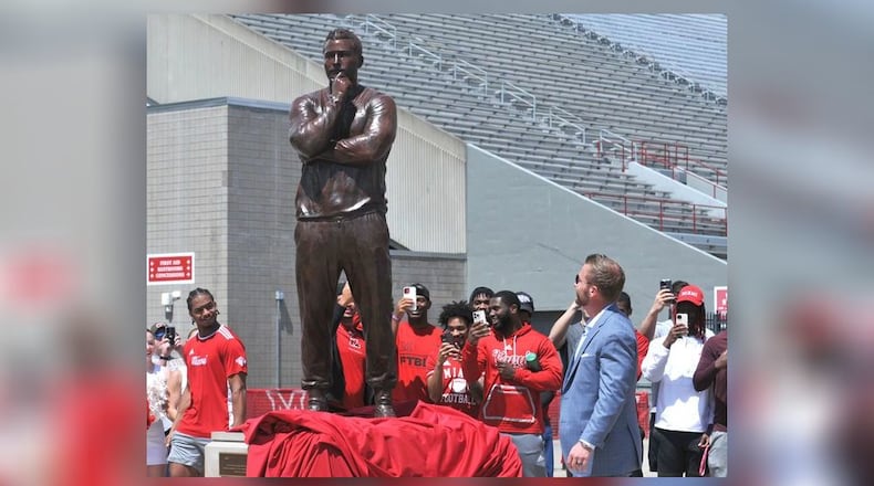 Sean McVay, head coach of the Los Angeles Rams and Miami University graduate, unveils his statue at the university's Cradle of Coaches Plaza on Saturday, May 6. McVay is the 10th Miami alumnus to be honored with a statue on the plaza. DAVID A. MOODIE/CONTRIBUTING PHOTOGRAPHER