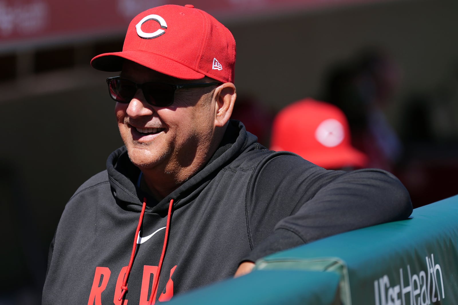 Cincinnati Reds' Terry Francona smiles as he pauses in the team dugout prior to a spring training baseball game against the San Francisco Giants Friday, March 6, 2026, in Scottsdale, Ariz. (AP Photo/Ross D. Franklin)