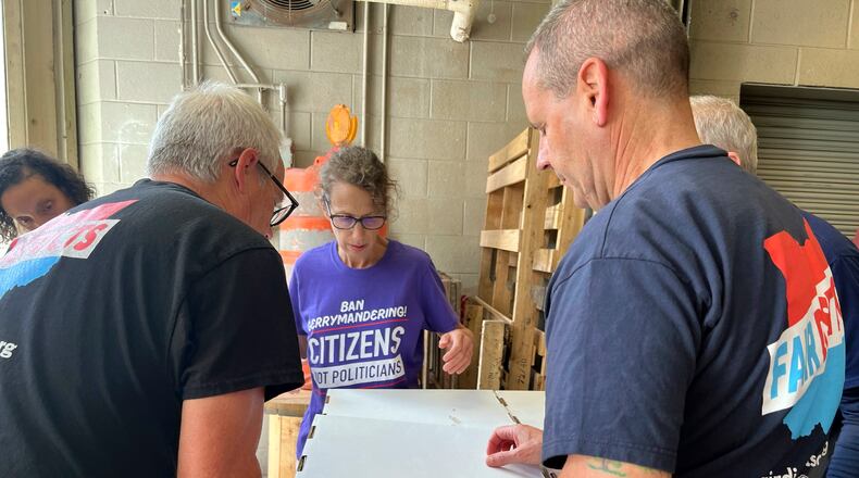 Volunteers with Citizens Not Politicians load boxes of signed petitions to Secretary of State Frank LaRose's office on Monday, July 1, 2024, in Columbus, Ohio. Backers of a proposal to change Ohio's troubled political mapmaking system delivered hundreds of thousands of signatures on Monday as they work to qualify for the statewide ballot this fall. (AP Photo/Patrick Orsagos)