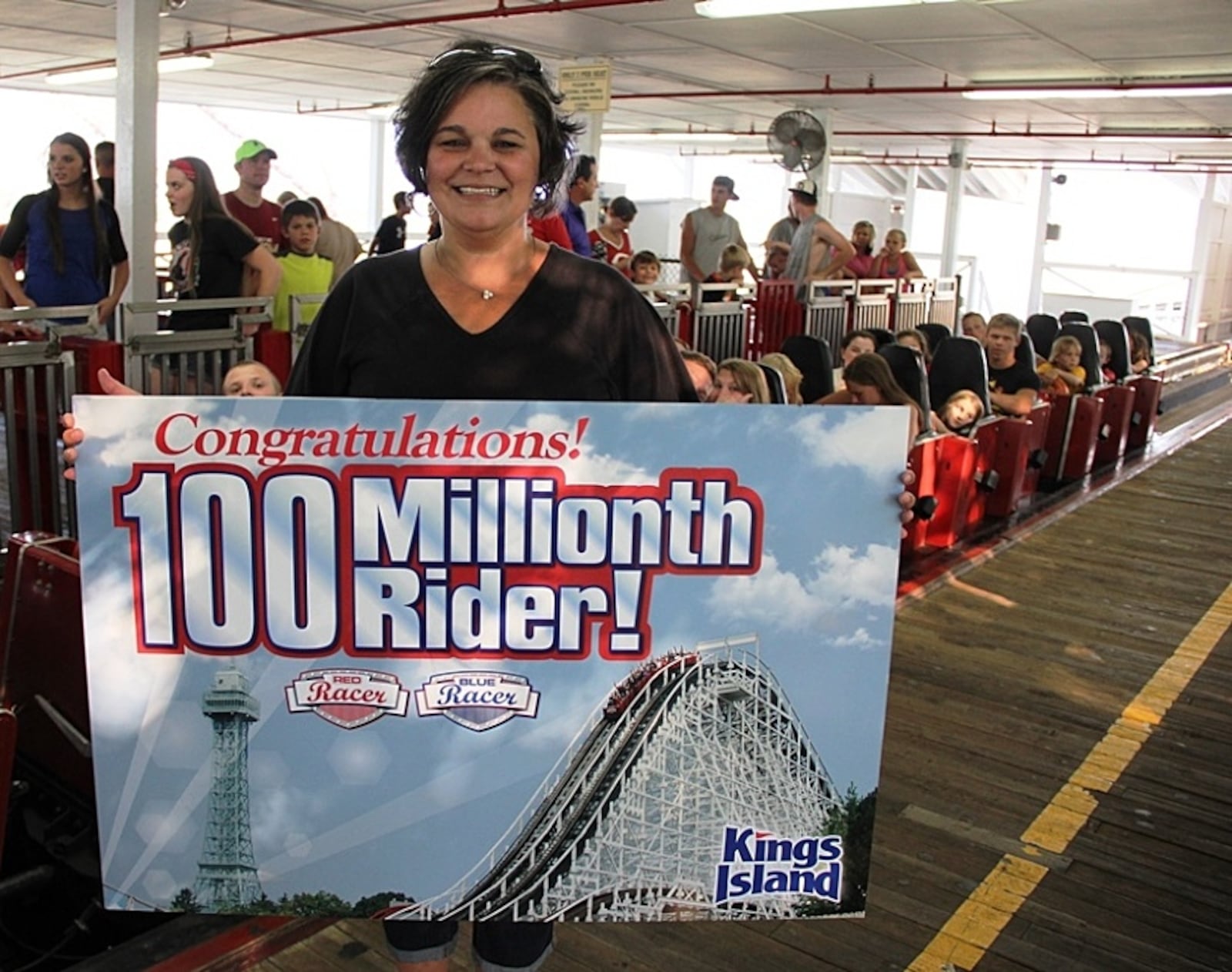 A Tennessee woman on Friday scored the 100 millionth ride on the Racer roller coaster at Kings Island. Contributed
