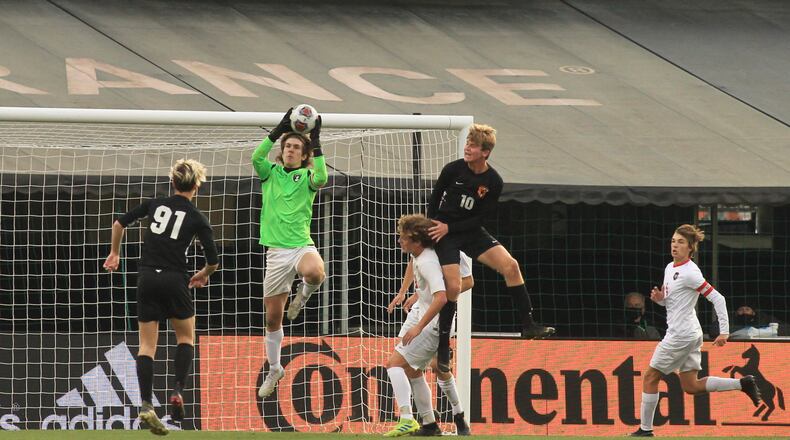 Tippecanoe's Clay Vaughn makes a save in the first half against Warren Howland in the Division II state championship game on Saturday, Nov. 14, 2020, at MAPFRE Stadium in Columbus. David Jablonski/Staff