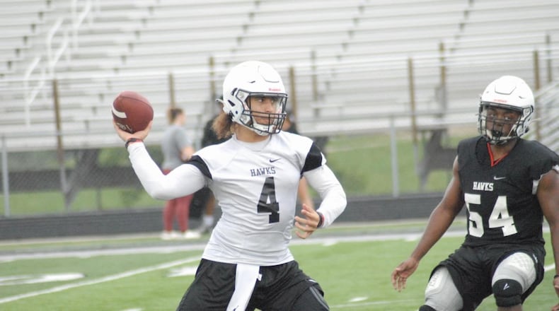 Lakota East quarterback JT Kitna gets ready to throw a pass during a recent practice. Chris Vogt/CONTRIBUTED