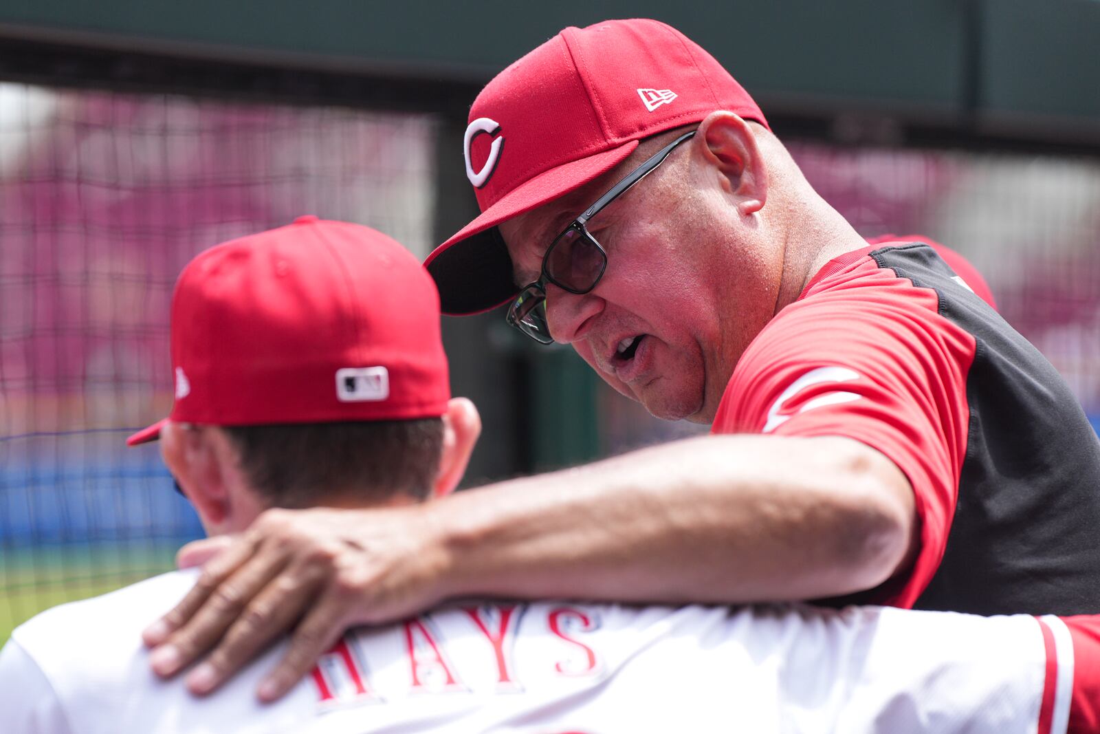 Cincinnati Reds manager Terry Francona, right, speaks with Austin Hays (12) during the fifth inning of the first baseball game of a doubleheader against the St. Louis Cardinals, Wednesday, April 30, 2025, in Cincinnati. (AP Photo/Jeff Dean)