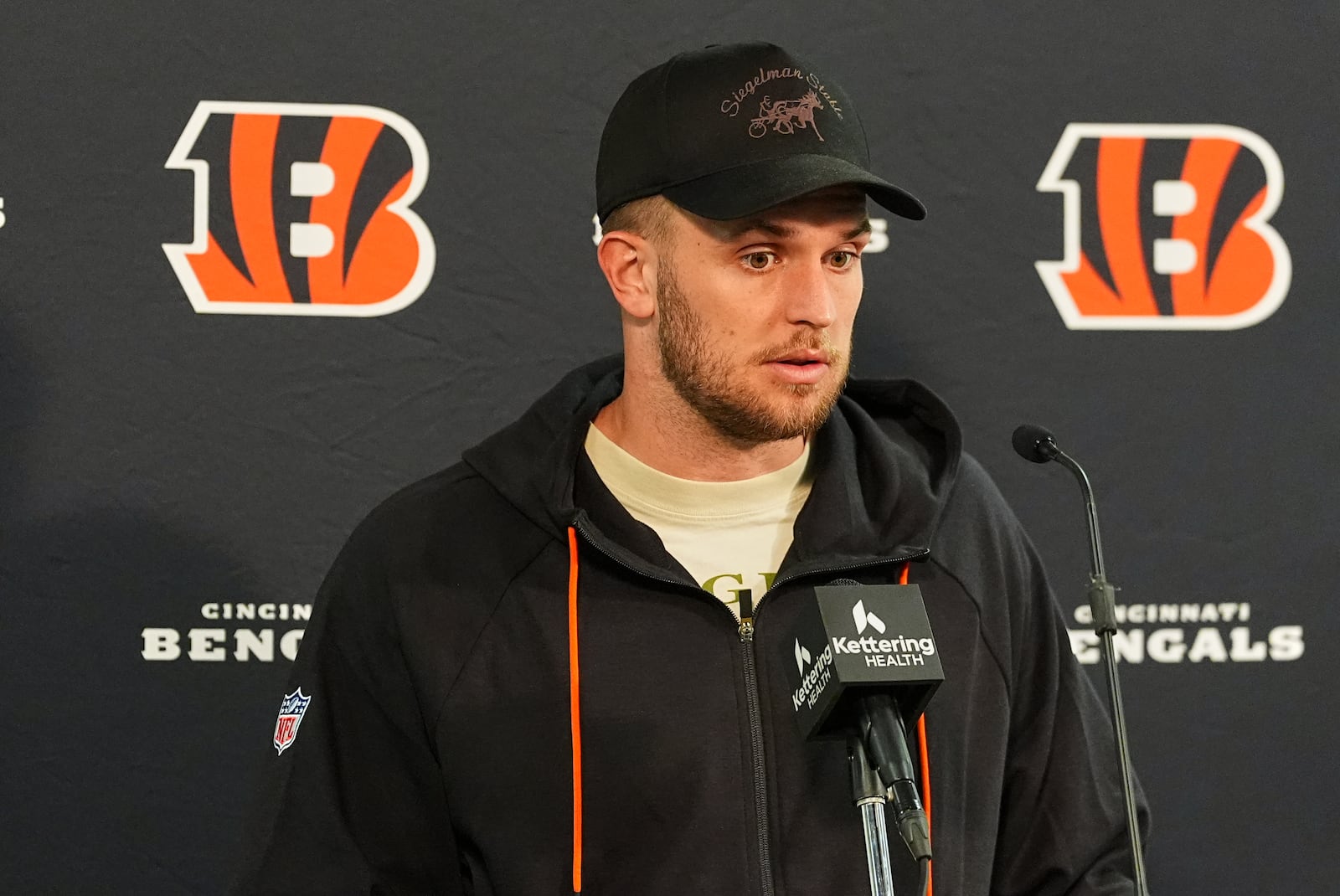 Cincinnati Bengals quarterback Jake Browning responds to questions during a news conference after an NFL football game Monday, Sept. 29, 2025, in Denver. (AP Photo/David Zalubowski)