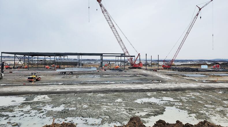 Construction continues as Koch Foods adds a $200 million-plus investment into an expansion of its operations. The company is building a new structure on an 18-acre site adjacent to its current facility on Port Union Road. NICK GRAHAM/STAFF