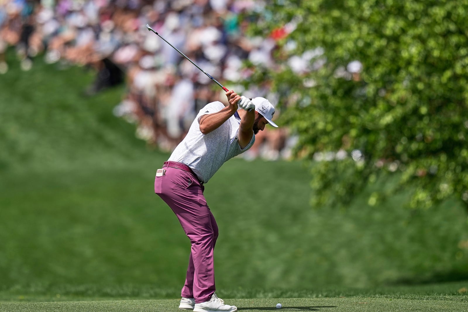 Jon Rahm, of Spain, hits from the fairway on the first hole during the third round of the PGA Championship golf tournament at the Quail Hollow Club, Saturday, May 17, 2025, in Charlotte, N.C. (AP Photo/David J. Phillip)