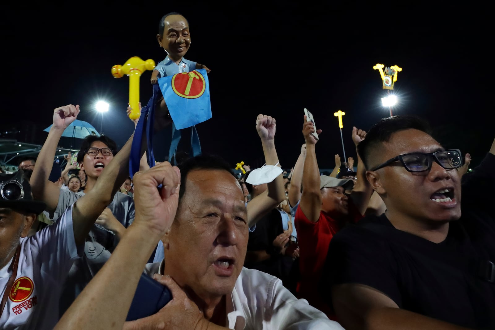 Workers' Party (WP) supporters react at an assembly centre during the general election, in Singapore, Saturday, May 3, 2025. (AP Photo/Suhaimi Abdullah)