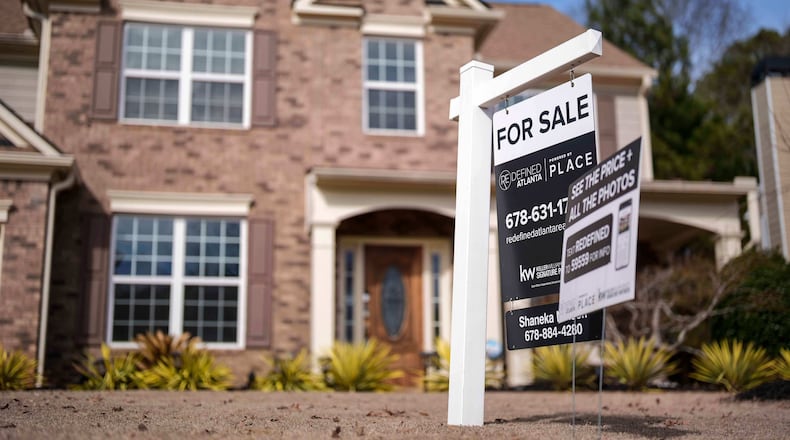 FILE - A "For Sale" sign is displayed outside a home, Feb. 1, 2024, in Aceworth, Ga. (AP Photo/Mike Stewart, File)