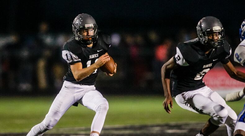 Lakota East quarterback Dylan Fry carries the ball during the Thunderhawks’ 31-28 victory over visiting Hamilton on Sept. 30. NICK GRAHAM/STAFF