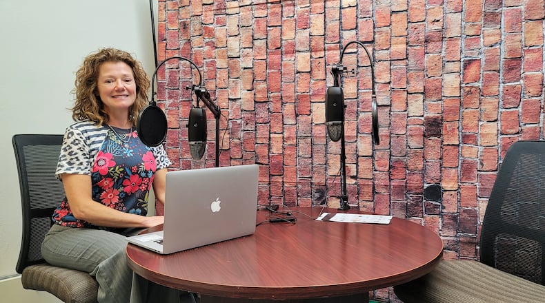 Yvonne VanBibber sits in the new podcast studio in the cowork space at The Benison event center in Hamilton. The studio is available for rent or for use by people using the coworking space. NICK GRAHAM / STAFF