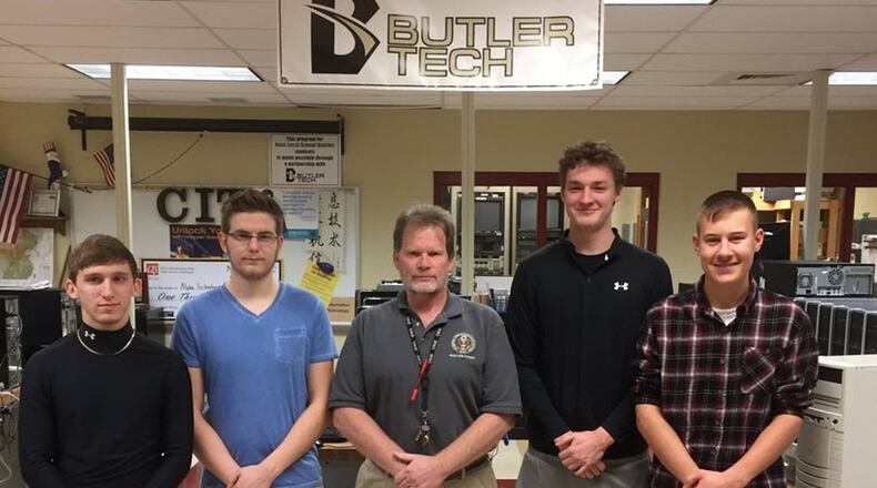 Students from Ross High School in Butler County have designed a school security cell phone app. Their team has been named one of 10 national finalists in Samsung Solve for Tomorrow contest, which will be held next month in Washington, D.C. Pictured (from left) are: Kody Bryant, Tyler West, instructor Thomas O Neill, Grant Ridge and Jacob Halm. CONTRIBUTED