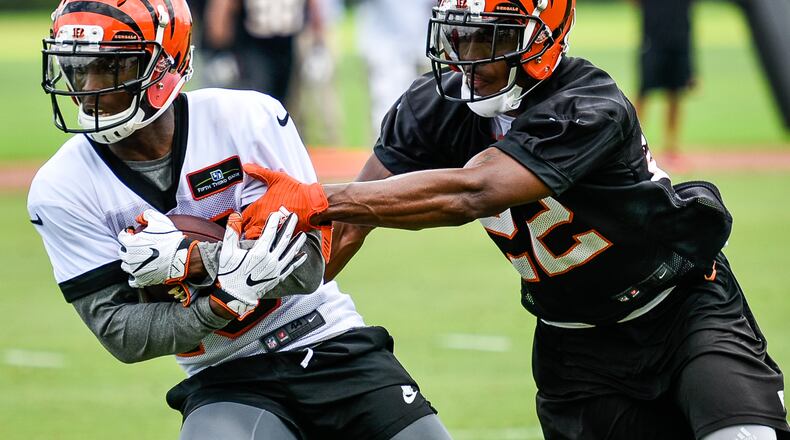 Bengals’ wide receiver John Ross catches a pass defended by cornerback William Jackson during organized team activities Tuesday, May 22 at the practice facility near Paul Brown Stadium in Cincinnati. NICK GRAHAM/STAFF