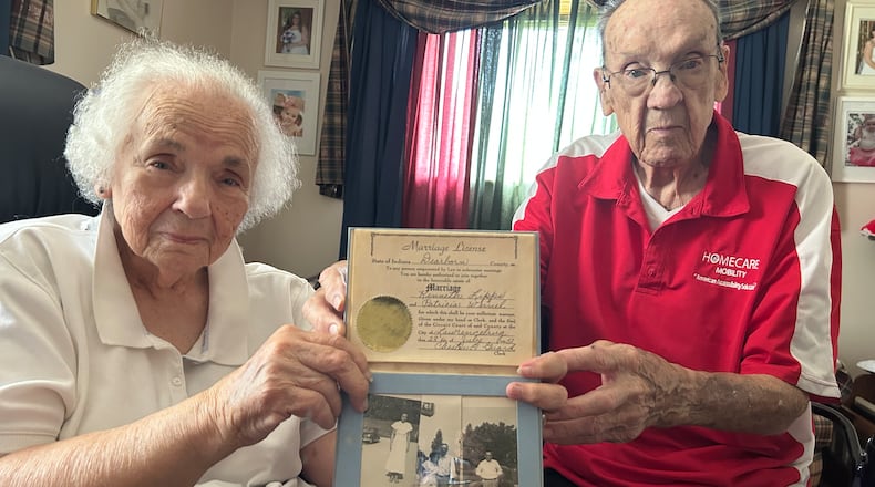 Pat and Kenny Lipps, who have been married for 74 years, hold their marriage license from July 28, 1951. They secretly went to Indiana to get married when Pat was 15 and Kenny was 17. RICK McCRABB/CONTRIBUTOR