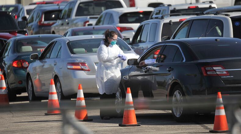Crowds line up for antibody testing at UD Arena. The COVID-19 lgG test helps people determine if they had COVID-19 infection. MARSHALL GORBY/STAFF