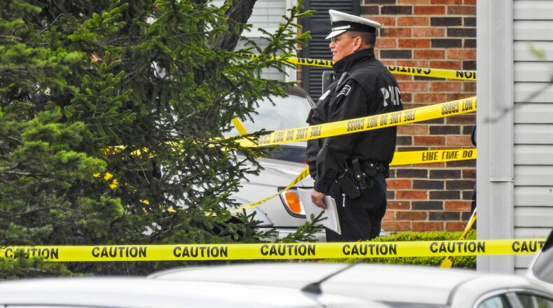 West Chester Police investigate at the scene where four people were found dead with apparent gunshot wounds inside an apartment at Lakefront at West Chester apartment complex on Wyndtree Drive in West Chester Township Monday, April 29, 2019. NICK GRAHAM/STAFF
