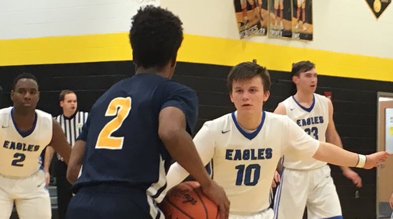 Middletown Christian’s Seth Wolfenbarger (10) guards Mylan Hall (2) of Cincinnati College Prep Academy on March 3, 2018, during a Division IV sectional final at Taylor. MCS won 101-99 in overtime. RICK CASSANO/STAFF