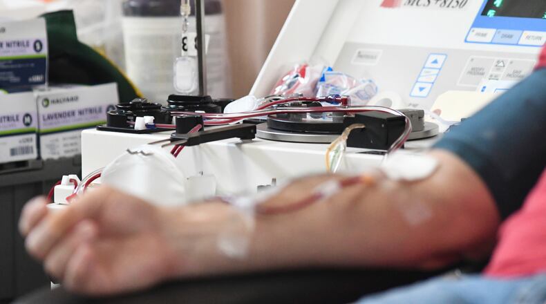 A man donates blood to the American Red Cross during a blood drive at Life Centre Foursquare Gospel in Pottsville, Pa. Thursday, Jan. 13, 2022. (Lindsey Shuey/Republican-Herald via AP)