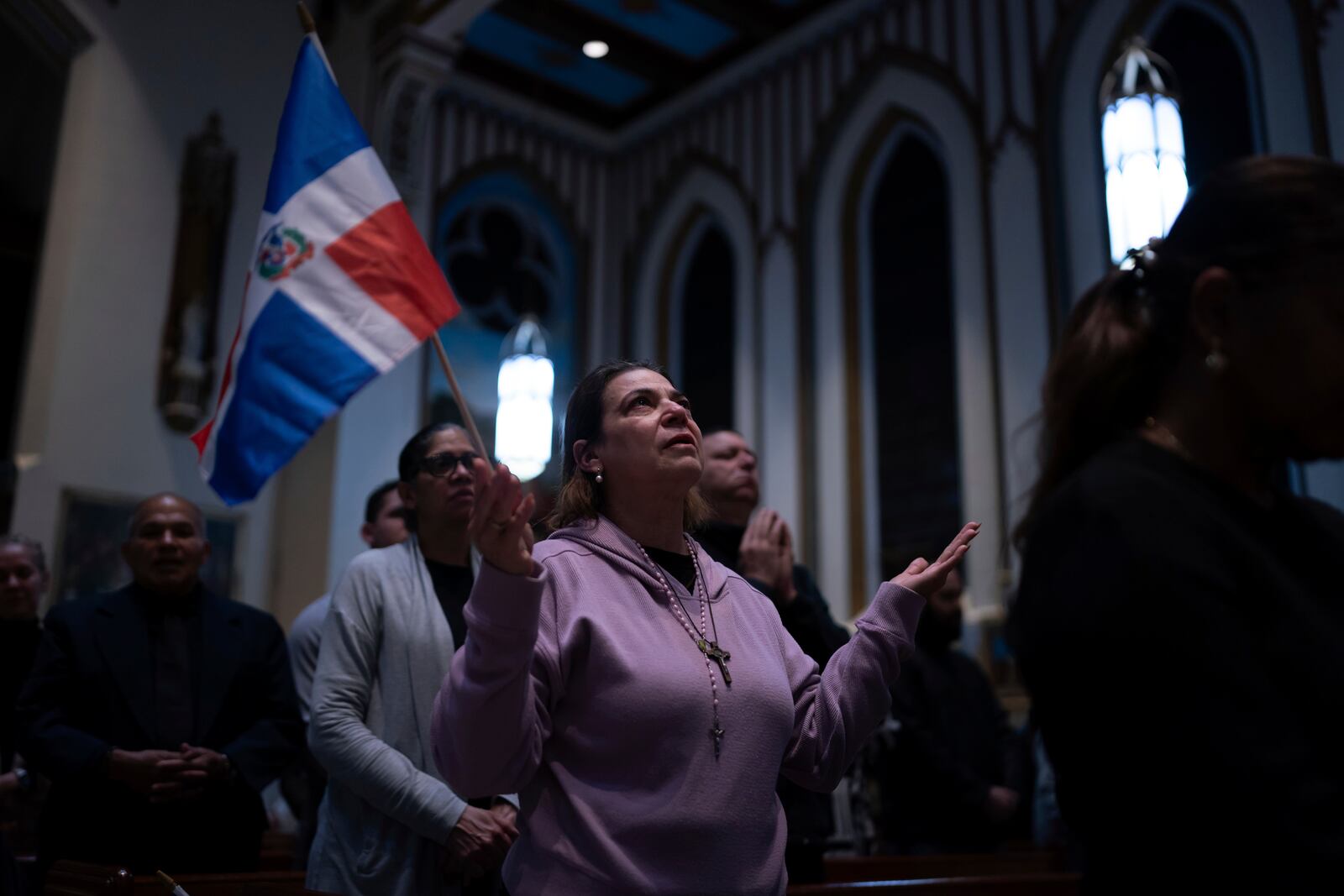 People attend a Mass for the victims of the Jet Set club roof collapse at St. Elizabeth's Church, Wednesday, April 9, 2025 in New York. (AP Photo/Adam Gray)