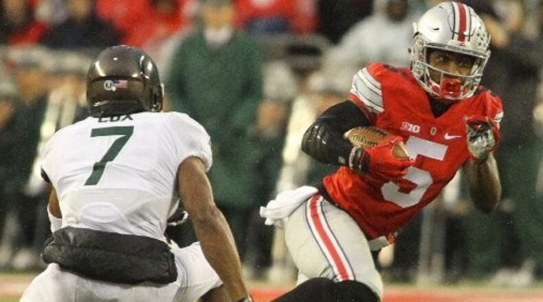 Ohio State’s Braxton Miller carries the ball on Saturday, Nov. 21, 2015, at Ohio Stadium in Columbus. David Jablonski/Staff
