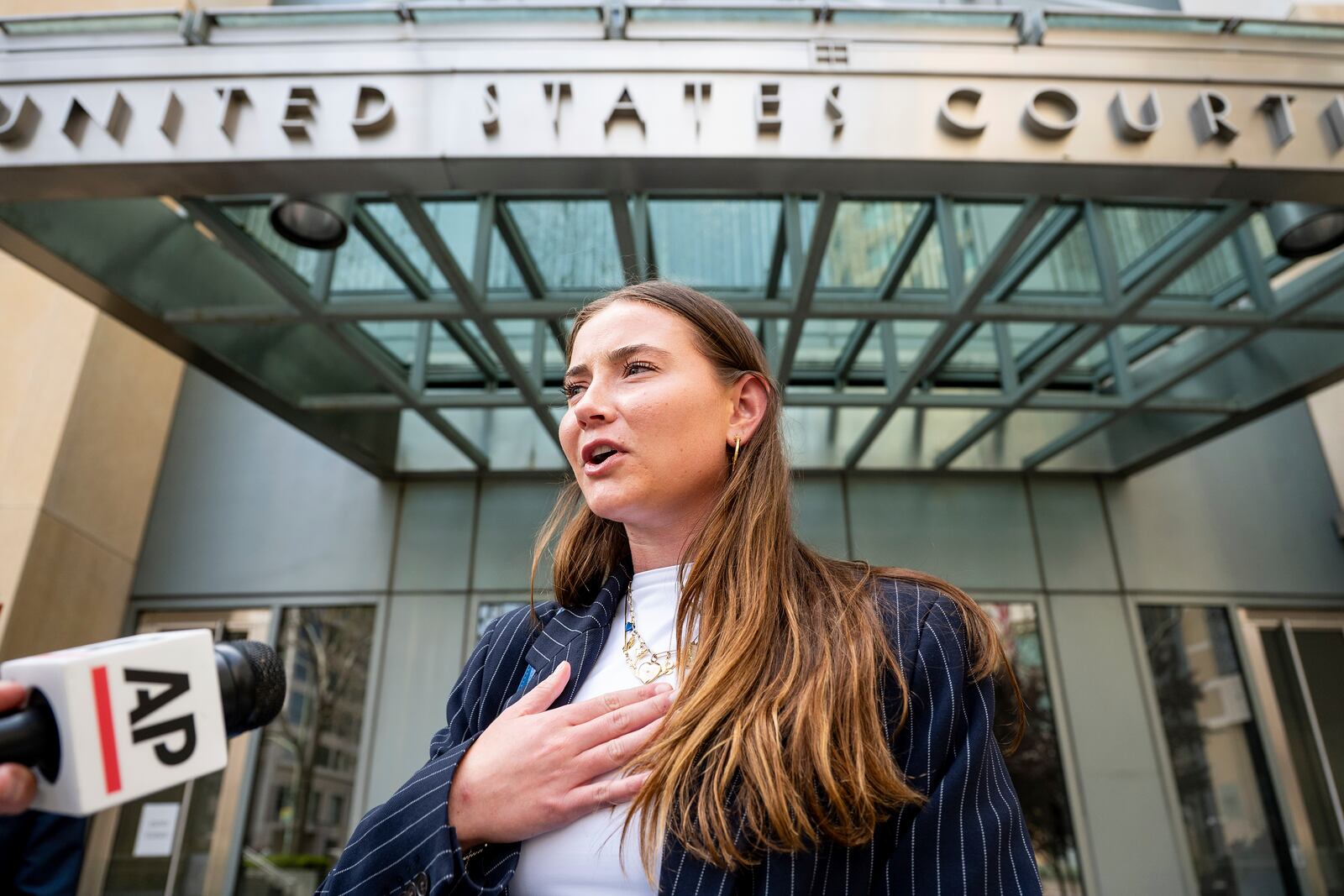 College soccer player Lexi Drumm leaves federal court during a hearing for a landmark $2.8 billion settlement impacting NCAA college athletics on Monday, April 7, 2025, in Oakland, Calif. (AP Photo/Noah Berger)