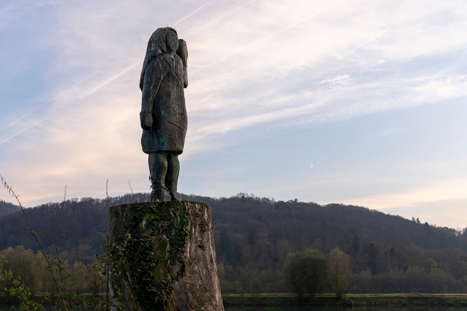 FILE -A bronze sculpture representing Melania Trump stands on a bank of the Sava river in the village of Rozno, near her hometown of Sevnica, Slovenia, Nov. 6, 2024. (AP Photo/Darko Bandic, File)