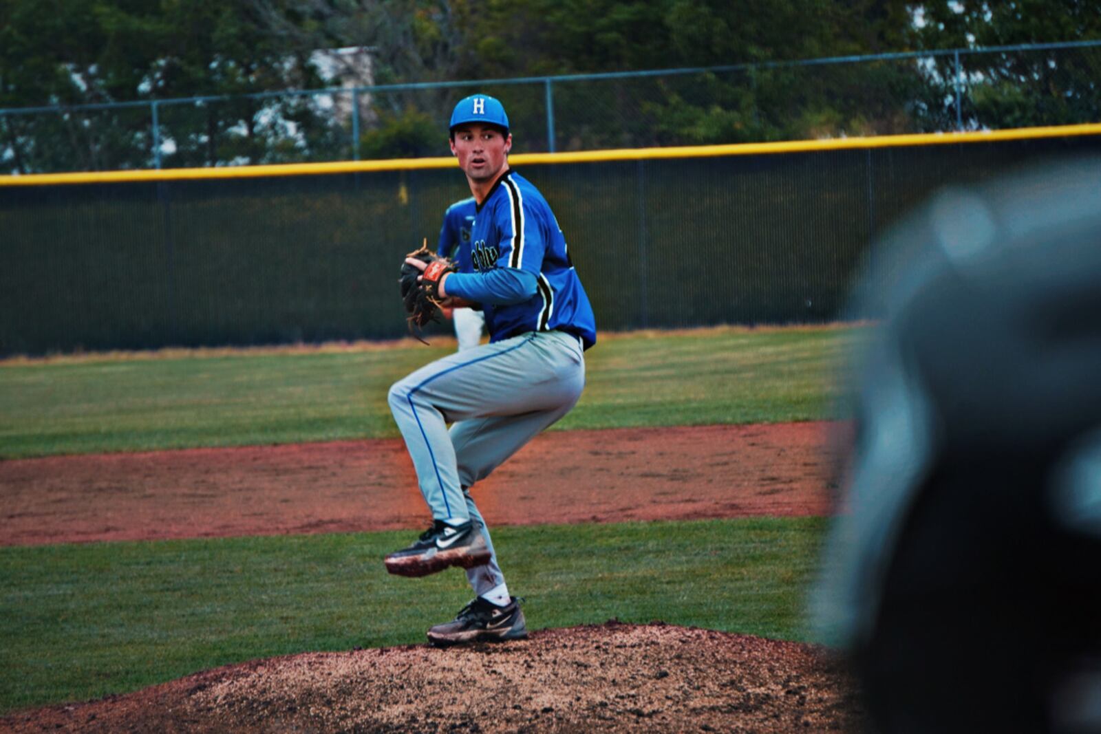 Hamilton pitcher Peyton Davis prepares to send a pitch to the plate during his Division I district semifinal game against Lakota East on Tuesday at Lakota East. CHRIS VOGT / CONTRIBUTED