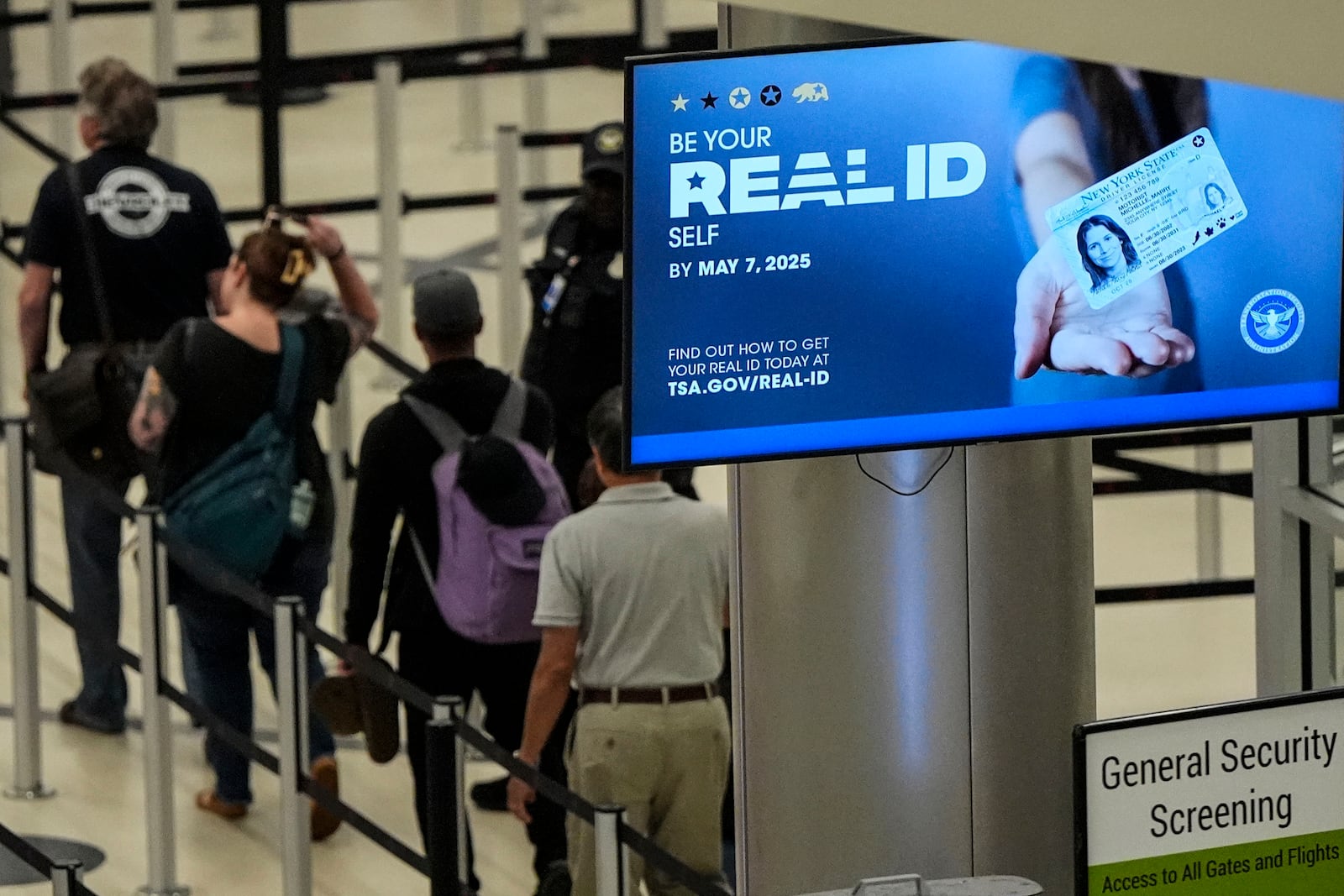 FILE - Travelers move through Hartsfield-Jackson Atlanta International Airport ahead of Memorial Day, Friday, May 24, 2024, in Atlanta.(AP Photo/Mike Stewart, File)