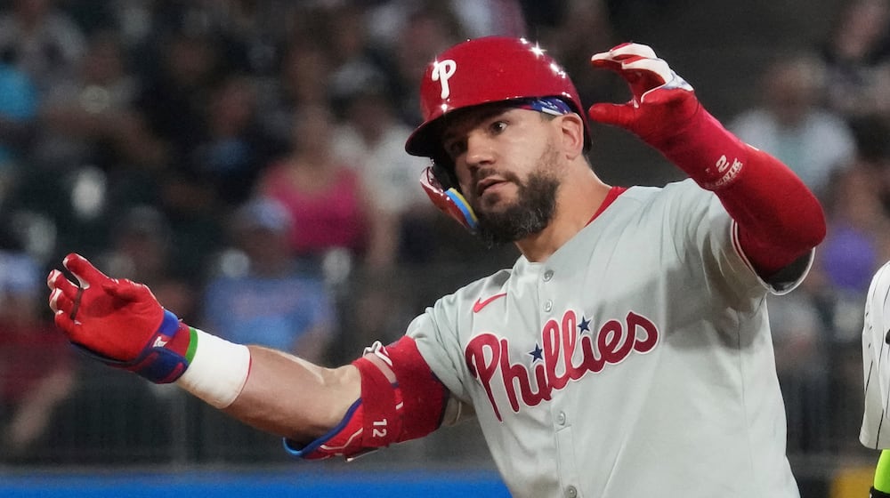 Philadelphia Phillies' Kyle Schwarber celebrates after hitting a double during the seventh inning of a baseball game against the Chicago White Sox in Chicago, Tuesday, July 29, 2025. (AP Photo/Nam Y. Huh)