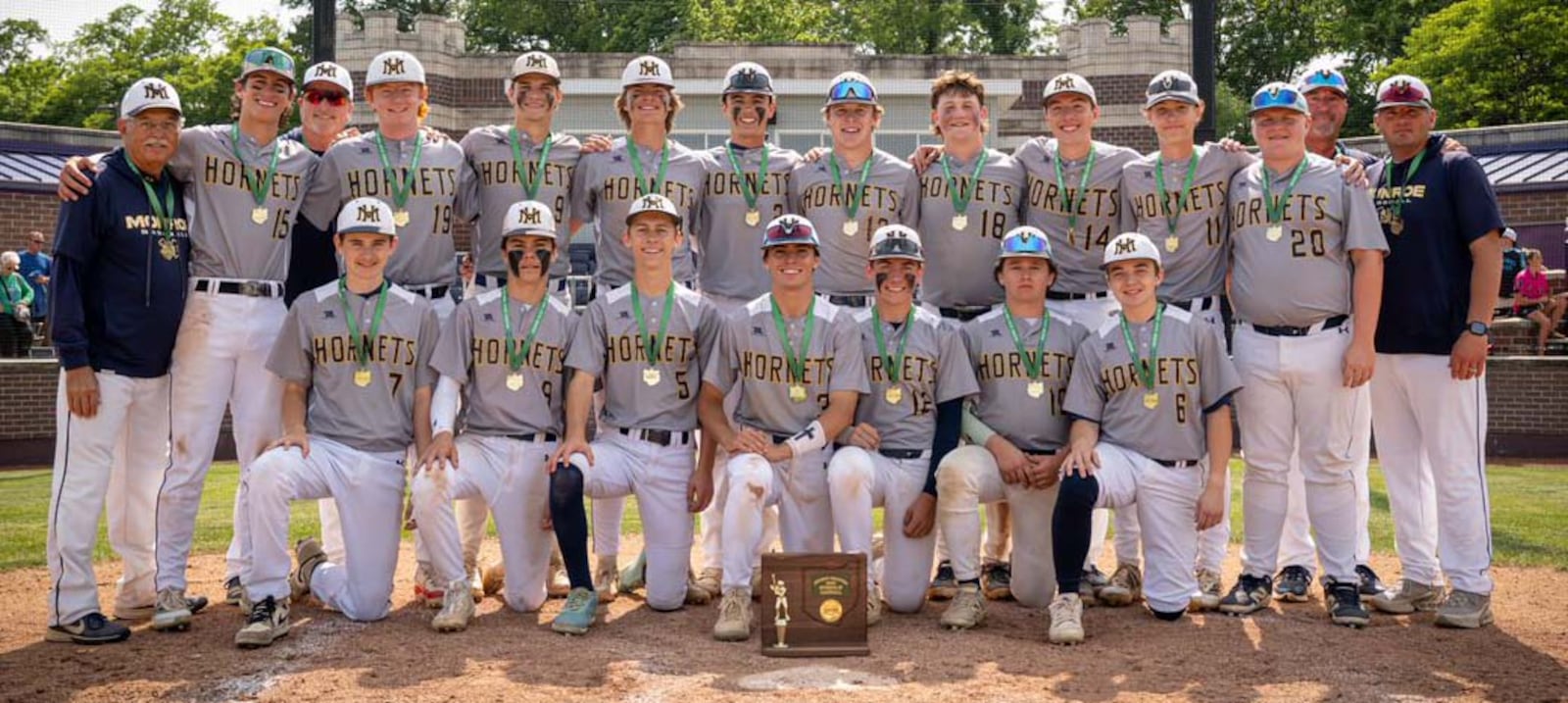 The Monroe High School baseball team poses for pictures after winning a Division III district championship on Saturday. CONTRIBUTED