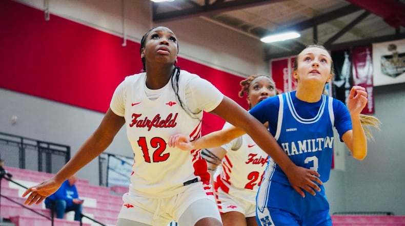 Fairfield junior Kobi Crim boxes out Hamilton junior Brookelyn Murrell (3) during their game on Wednesday night at Fairfield Arena. Chris Vogt/CONTRIBUTED