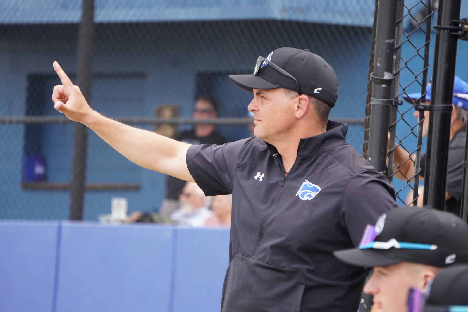 Cincinnati Christian coach Jim Birch signals to his players during their Division V district final against Carlisle on Thursday at Miamisburg. CHRIS VOGT / CONTRIBUTED
