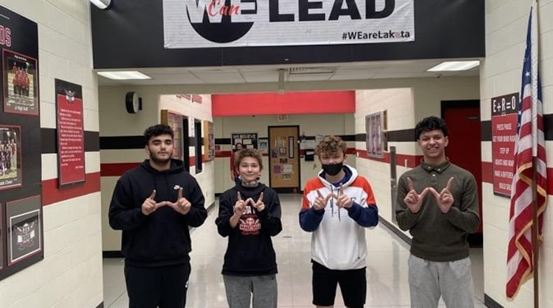The now three-year old Boys Club at Lakota's Ridge Junior School continues to see more boys join as the home-grown club grows in popularity. The club was started three years ago by a Ridge teacher with 10 members and now has 50 boys participating. Some of the members are pictured in a Ridge school hallway. (Provided Photo\Journal-News)
