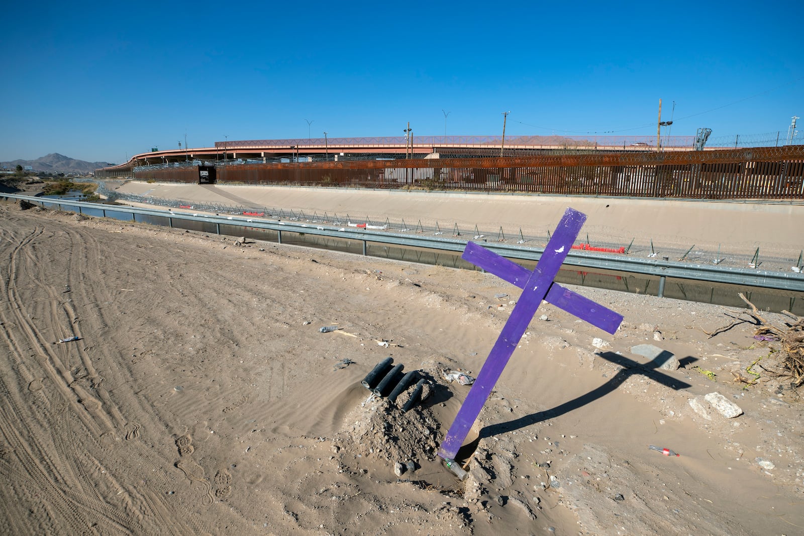 FILE - A cross stands on the Mexican side of the border with the United States hours before President-elect Donald Trump's inauguration, Jan. 19, 2025, in Ciudad Juarez, Mexico. (AP Photo/Andres Leighton, File)