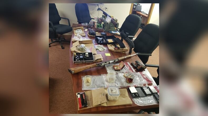 Butler County law enforcement on Dec. 16, 2021 served search warrants at a Trenton home that resulted in the confiscation of firearms, methamphetamine, LSD and a large amount of cash.