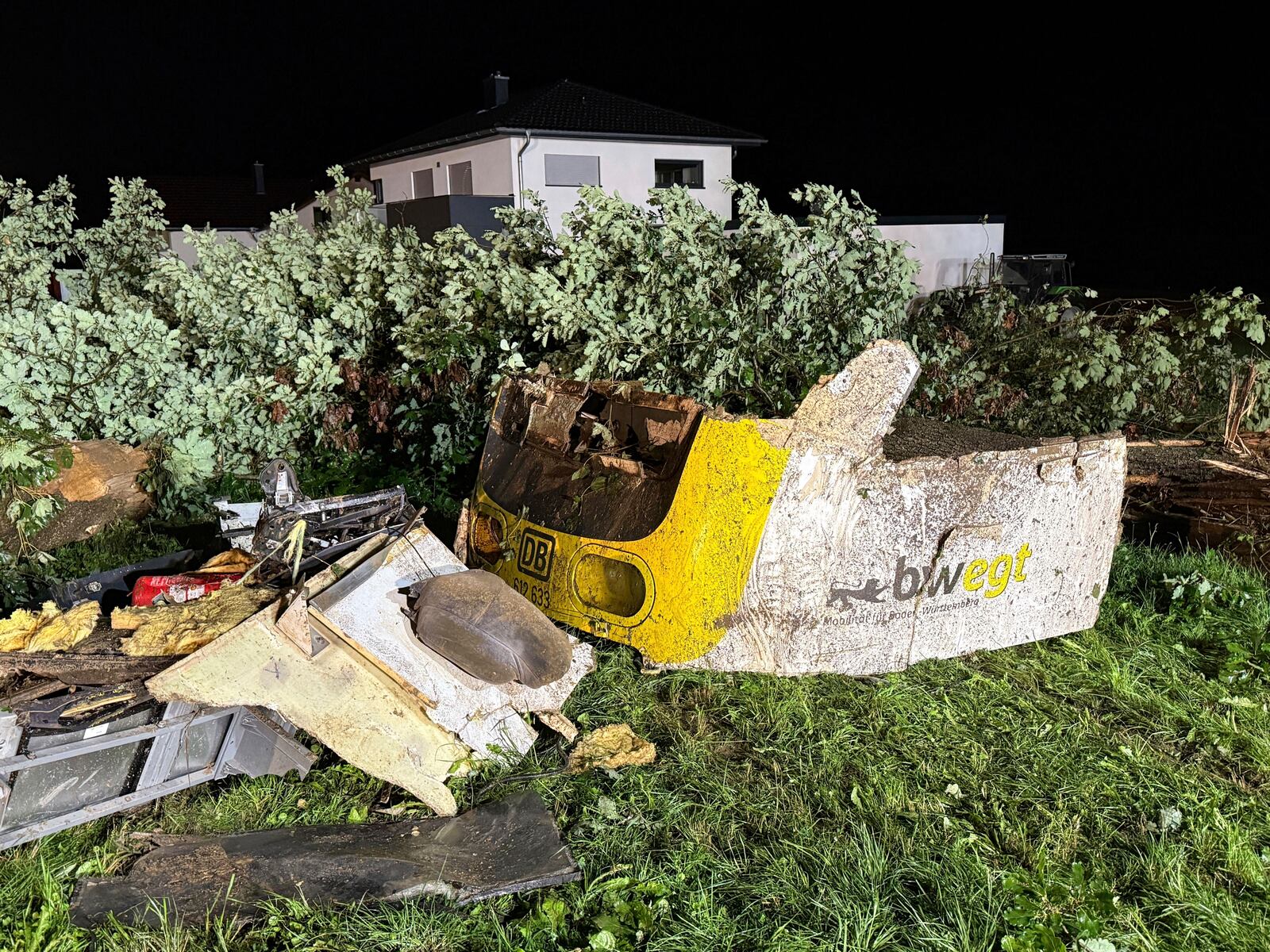 A front section of the derailed regional passenger train lies in a wooded section of track near Riedlingen, Germany, Sunday, July 27, 2025. (Nico Pointner/dpa via AP)