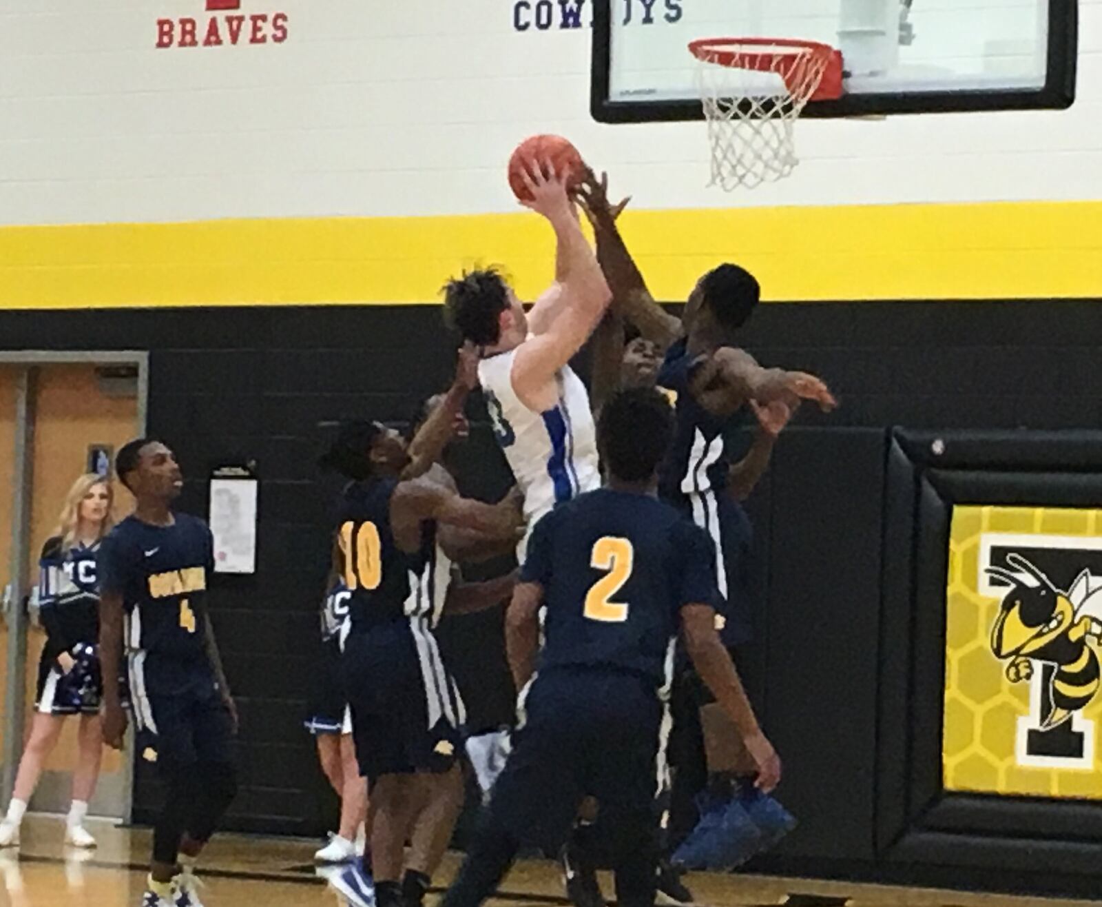 Middletown Christian’s Jarod Hamlin (33) goes up for a shot in a crowd of Cincinnati College Prep Academy bodies Saturday night during a Division IV sectional final at Taylor. RICK CASSANO/STAFF