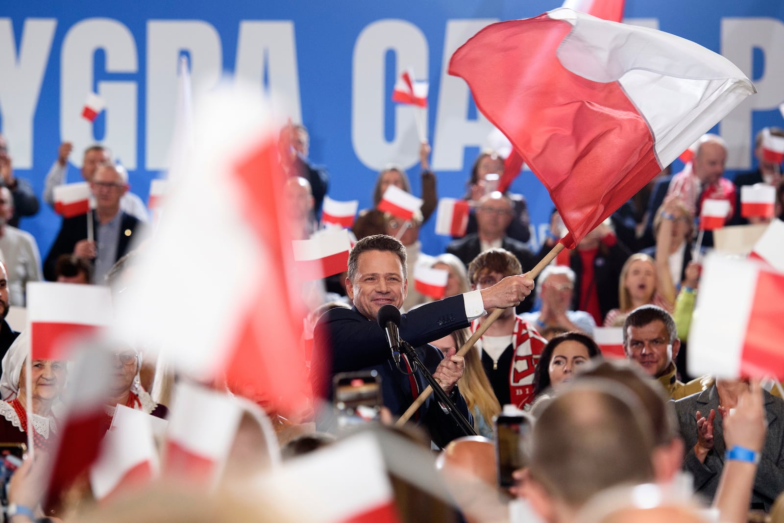 Warsaw's Mayor and presidential candidate Rafal Trzaskowski celebrates the exit poll results during presidential election night in Sandomierz, Poland, Sunday, May 18, 2025. (AP Photo/Aleksander Kalka)