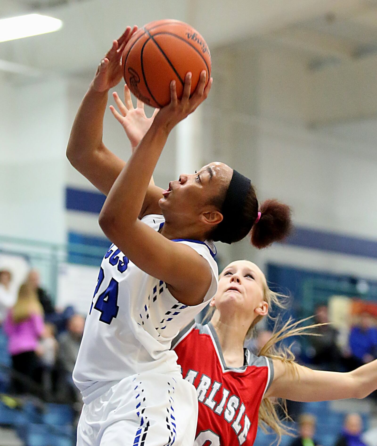 Cincinnati Christian guard Lyric Harris scores on Carlisle guard Christa Harris during their game at CCS on Jan. 7. CONTRIBUTED PHOTO BY E.L. HUBBARD
