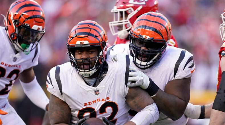 Cincinnati Bengals defensive end B.J. Hill (92) celebrates after intercepting a pass during the second half of the AFC championship NFL football game against the Kansas City Chiefs, Sunday, Jan. 30, 2022, in Kansas City, Mo. (AP Photo/Ed Zurga)